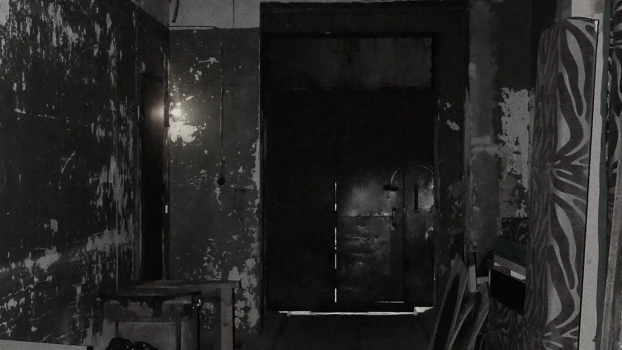 A peeling corridor inside an abandoned plant